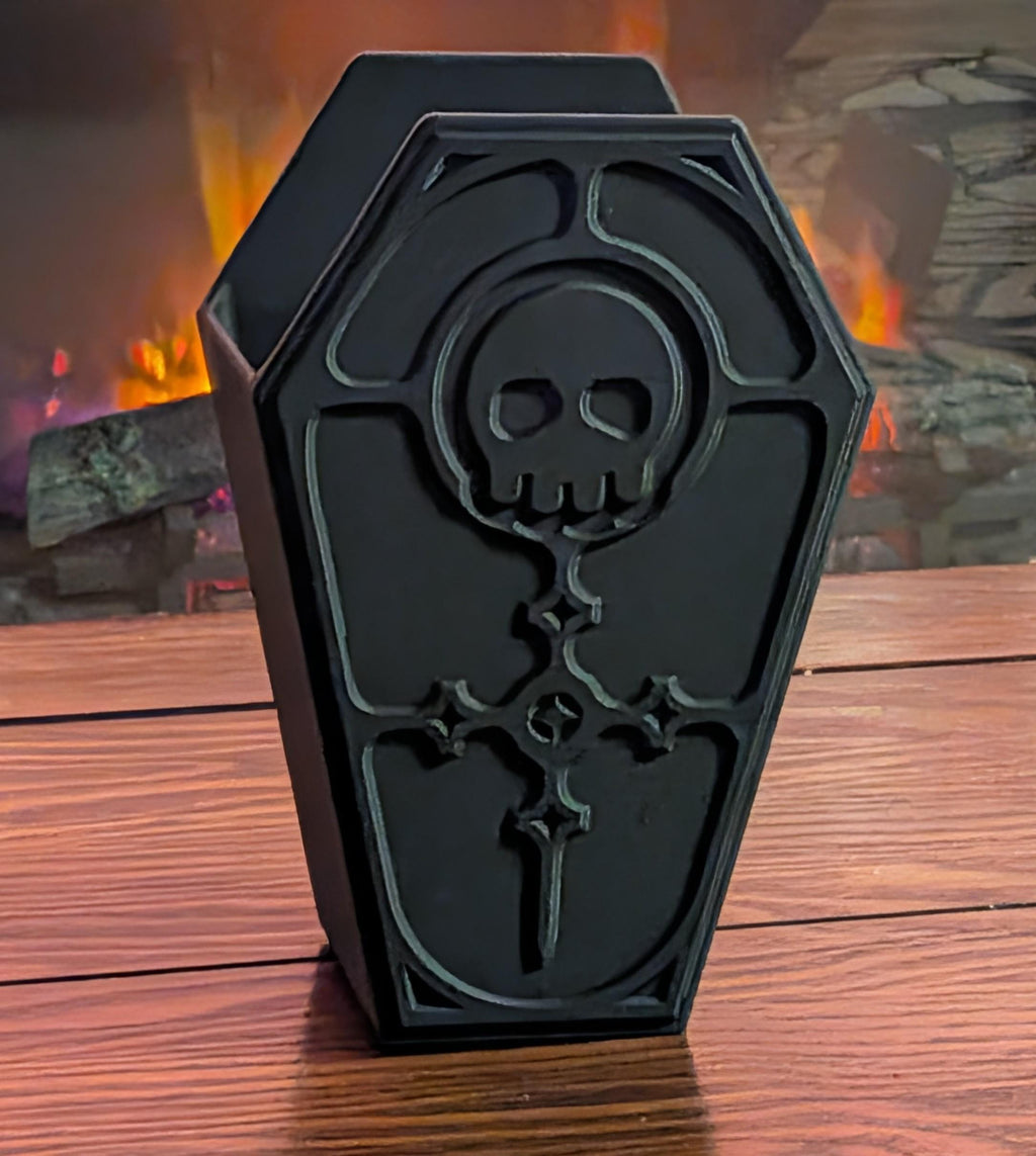 Luxury 3D printed coffin vanity organizer with intricate skull relief lid in matte charcoal black.