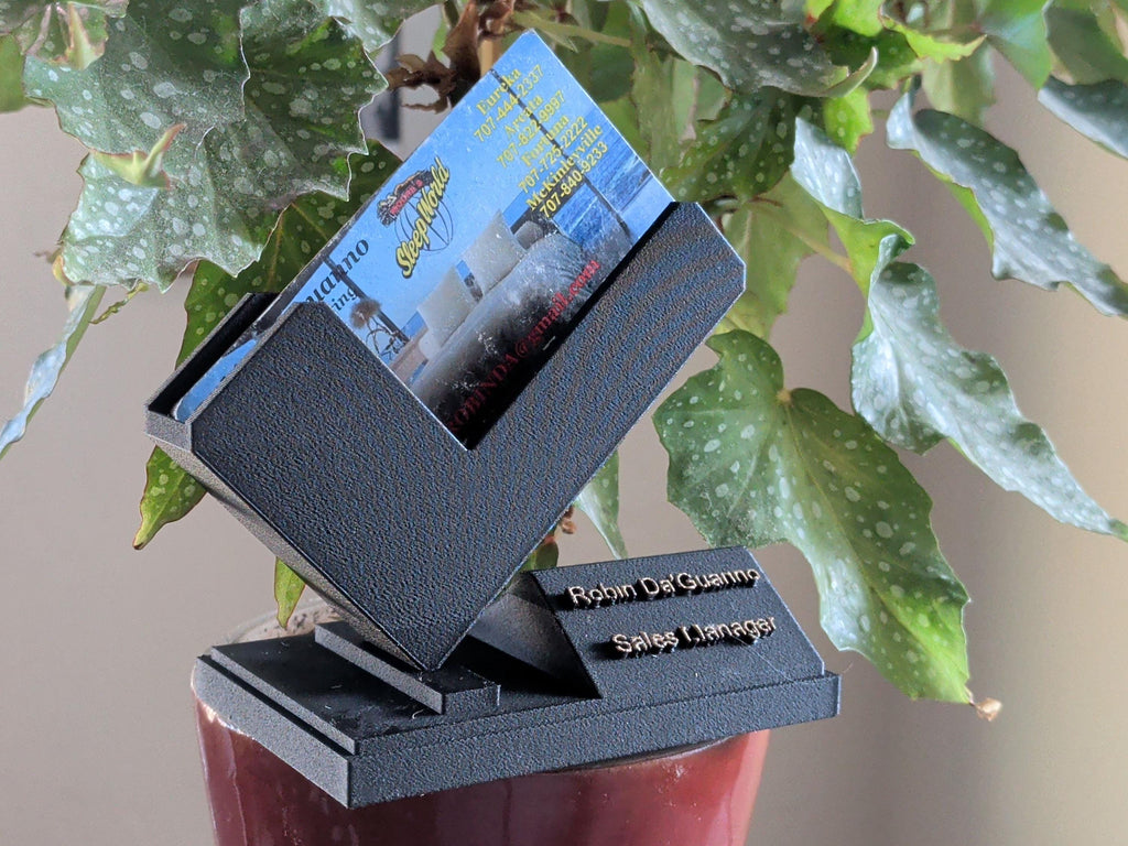 Modernist matte black business card holder for executives and luxury real estate branding tools.