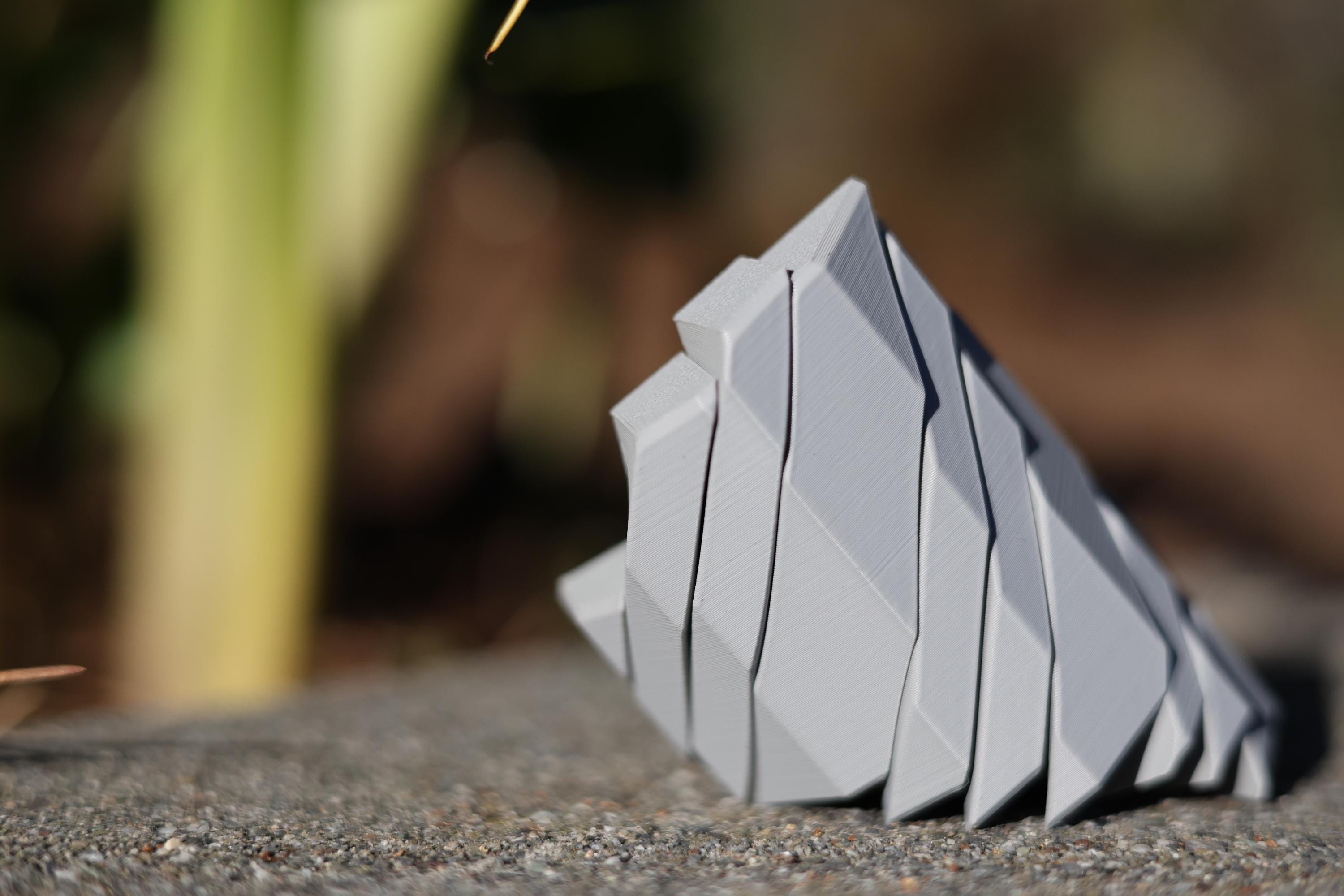 Collection of minimalist geometric desk toys in various colors, ideal for executive gifting and modern workspace decor.