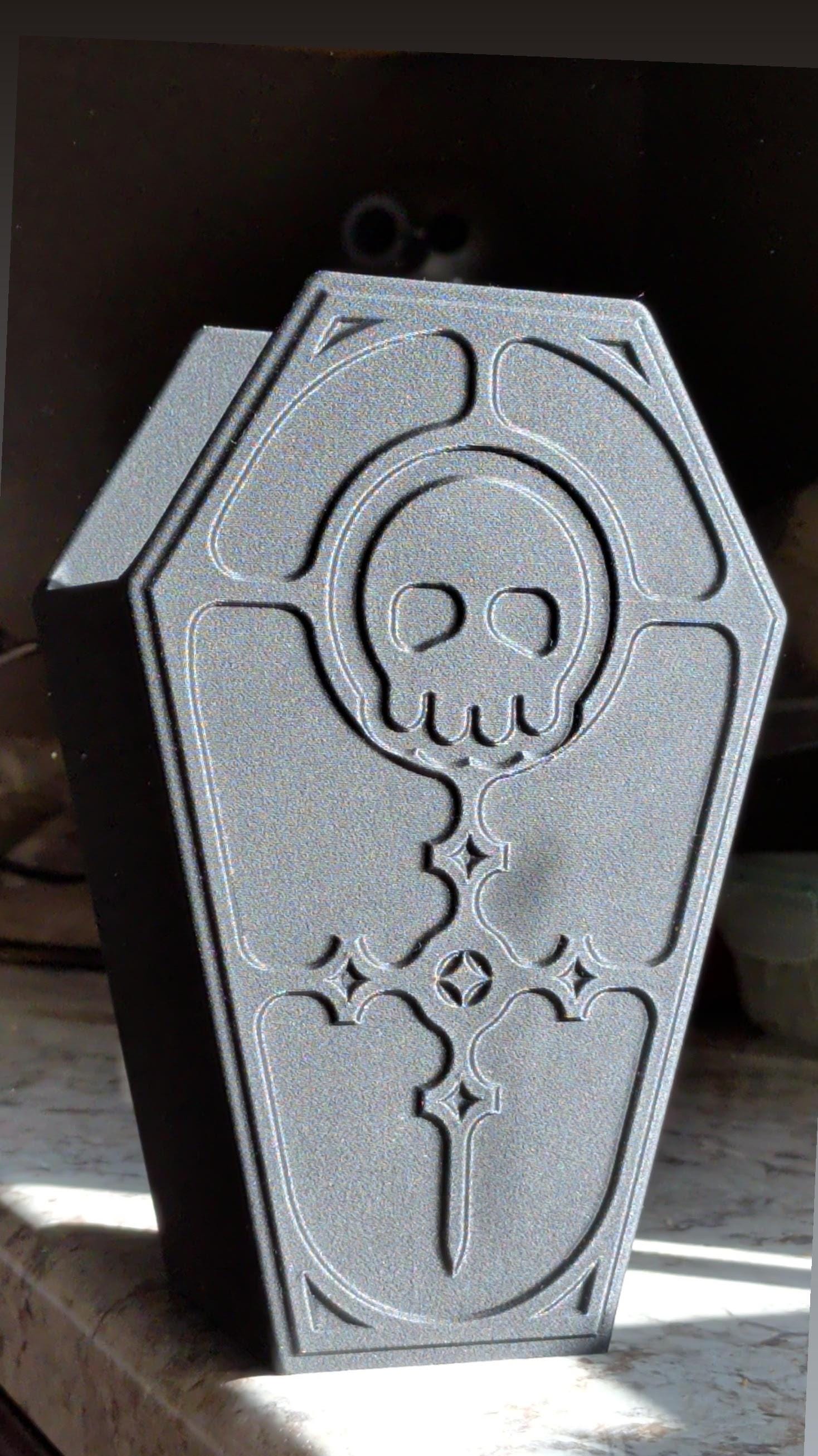 Detailed gothic coffin trinket box with ornate cross and skull accents for dark aesthetic bedroom decor.